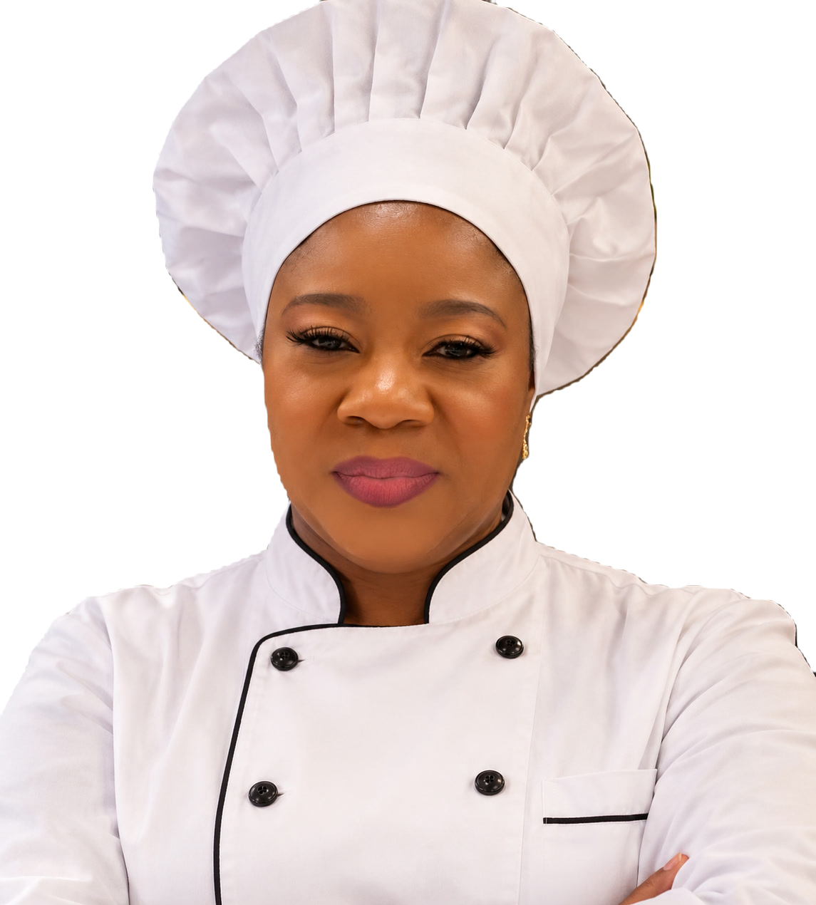 Adekunbi, founder and head cook of Fundel, in chef's whites with her arms folded